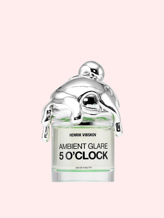 Perfume bottle labeled 'Ambient Glare 5 O'Clock' by Henrik Vibskov