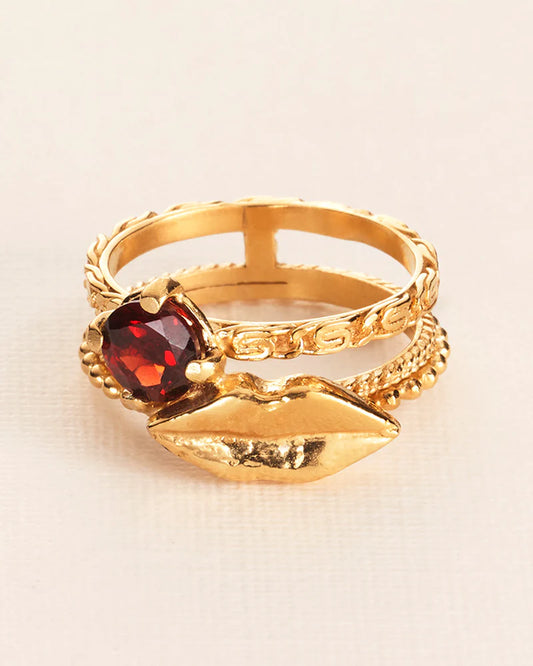 Trick or treat 'Chapters' ring with lip and garnet in silver