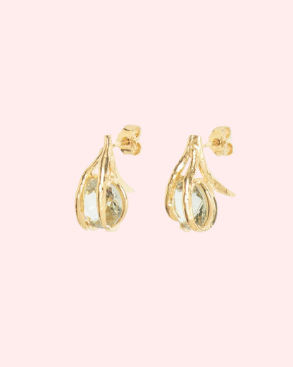 Gold earrings with green gemstones