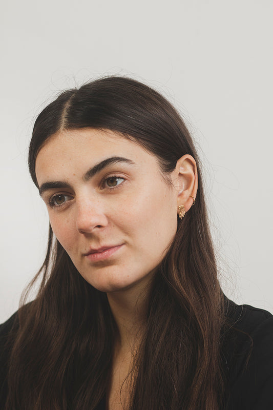Martine Viergever earrings Disco Small goldplated sterling silver on model