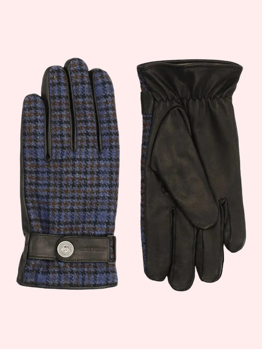 A pair of gloves shown side by side on a plain white background. The left glove features a blue and brown houndstooth pattern with black trim and a snap-button wrist strap.