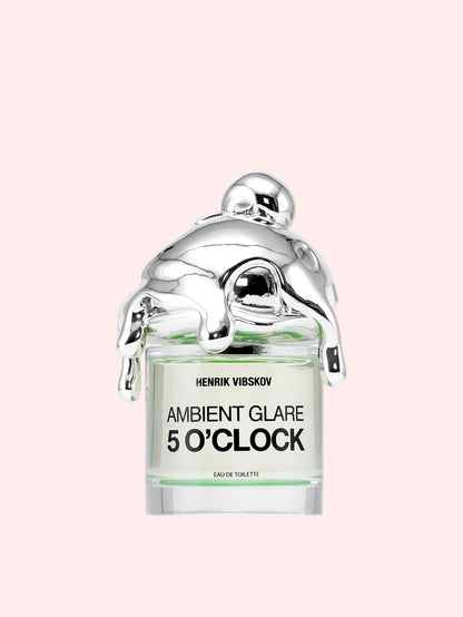 Perfume bottle labeled 'Ambient Glare 5 O'Clock' by Henrik Vibskov