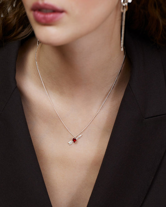 Necklace with heart-shaped garnet and arrow pendant