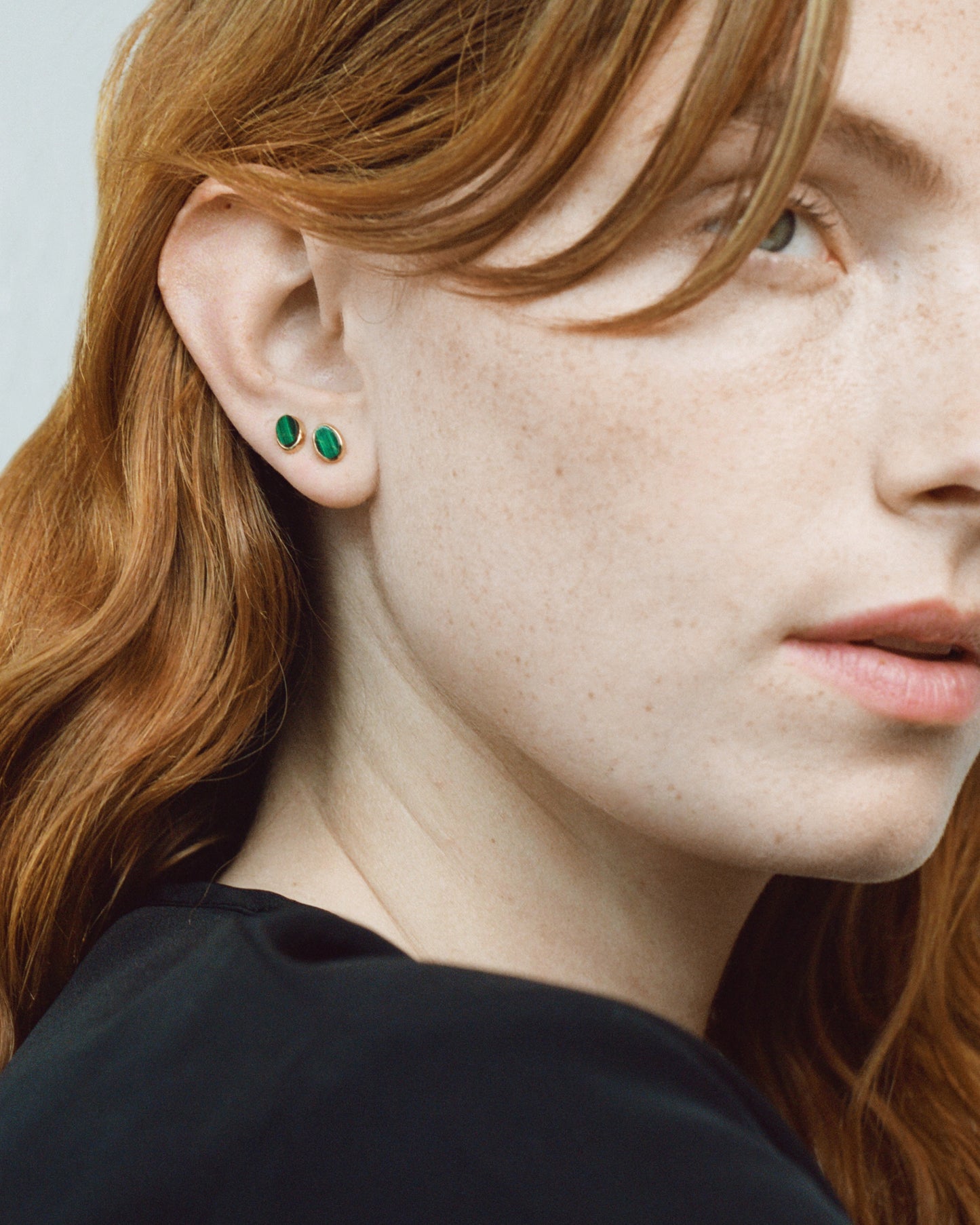 Stud earrings with malachite gold-plated silver